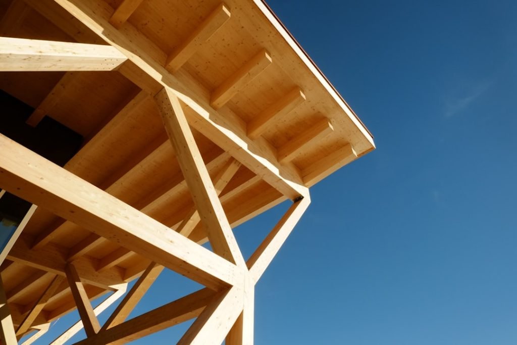 a-close-up-of-a-wooden-structure-against-a-blue-sky-3t8watpske4