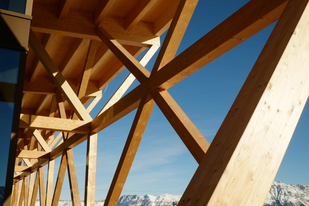 a-wooden-bridge-with-mountains-in-the-background-orkngix0fh0